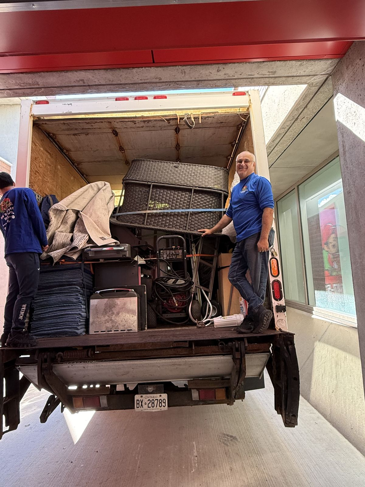 Movers loading a truck at a condo loading dock in Downtown Toronto